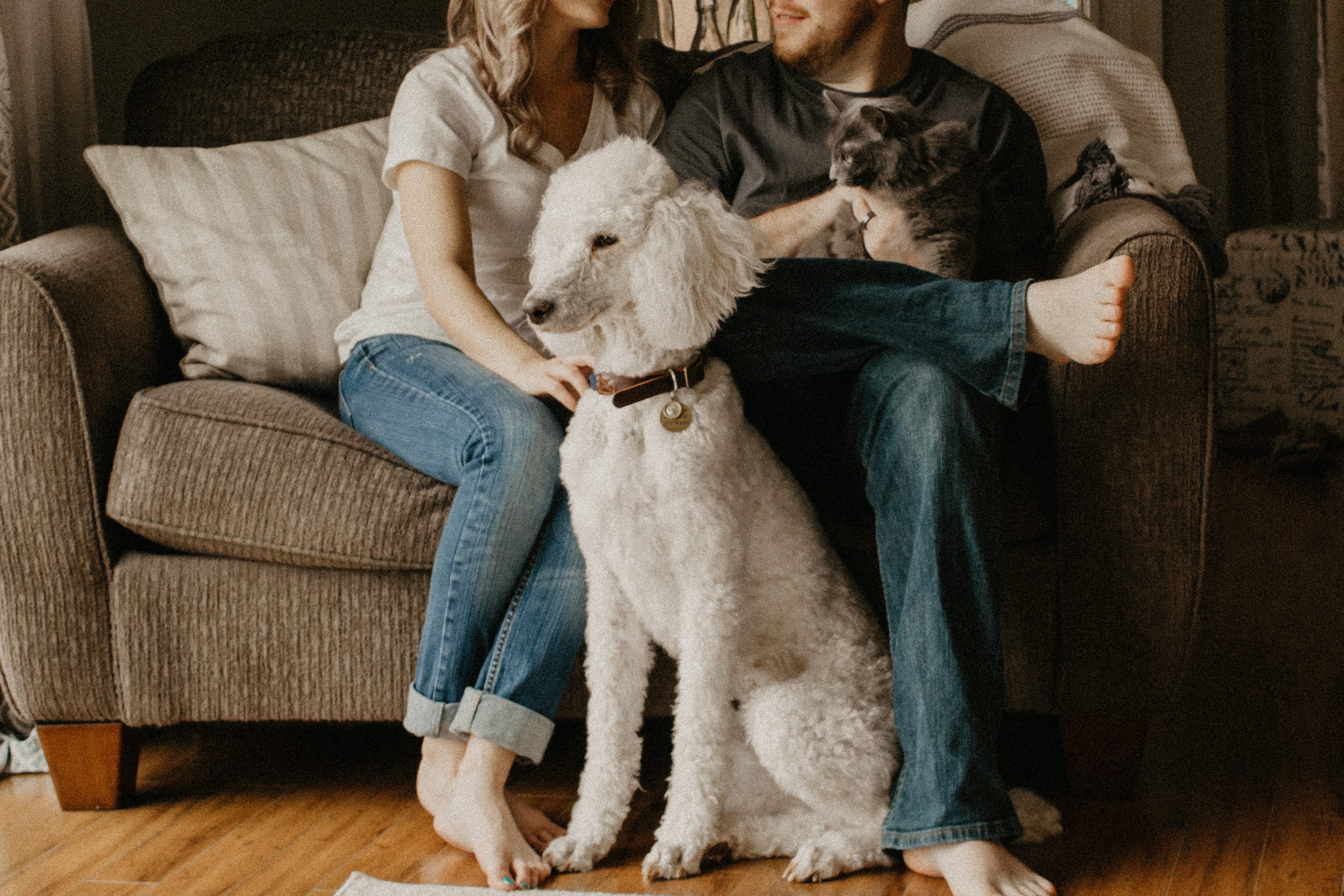 man and woman with dog